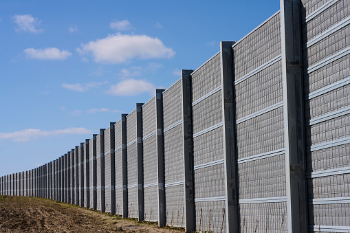 Wall protecting neighbors from noise from the road