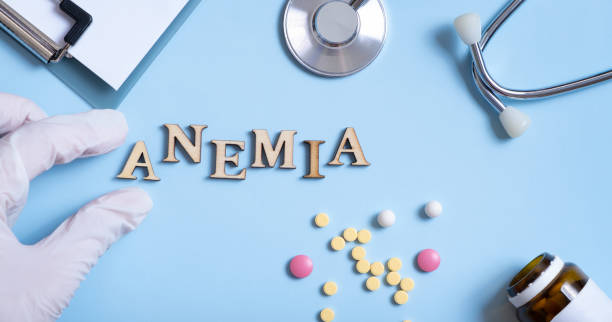 istock Anemia text with gloved hand, stethoscope, pills flat lay, top view 1486840957