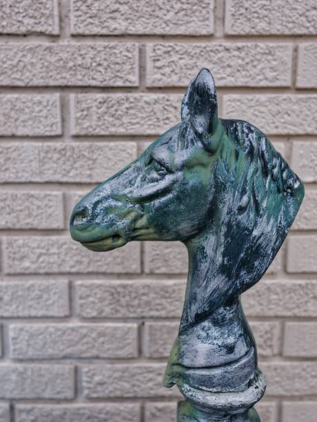 istock Horse Head Statue on Brick Background 1486843550