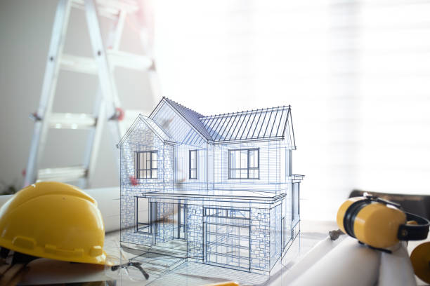 istock Hologram of a house project over blueprints 1486846438