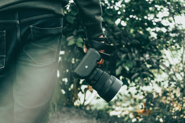 istock Photographer holding a professional Camera in his hand 1486846641
