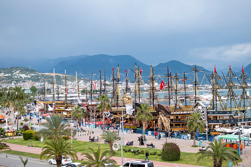Alanya - Antalya, Turkey, April 29 2023: Beautiful landscape Alanya harbor. Touristic cruise boats are ready to welcome their customers for the summer months.