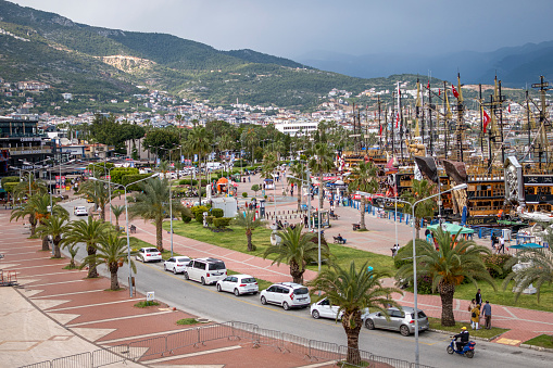 Alanya - Antalya, Turkey, April 29 2023: Beautiful landscape Alanya harbor. Touristic cruise boats are ready to welcome their customers for the summer months.