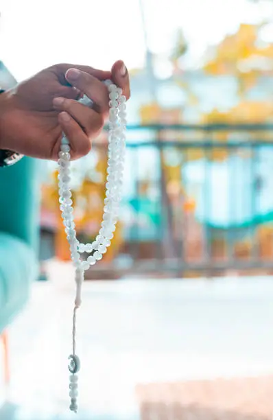 National mantra day concept image, hand holding Tasbih