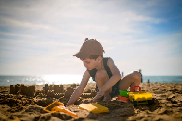 istock Child plays on the beach on summer holidays 1486856759