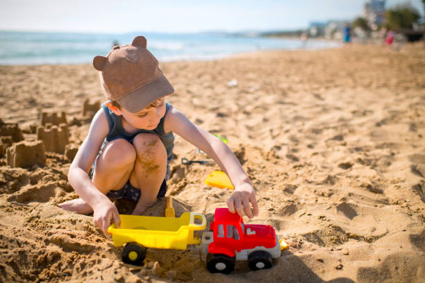 istock Child plays on the beach on summer holidays 1486856777