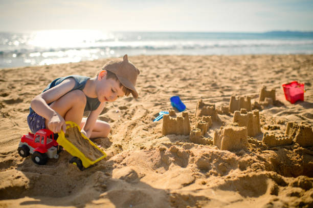 istock Child plays on the beach on summer holidays 1486856821