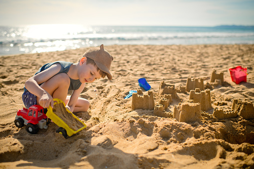 Little boy enjoying vacations near the sea