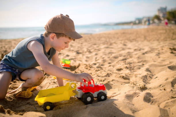 istock Child plays on the beach on summer holidays 1486856827