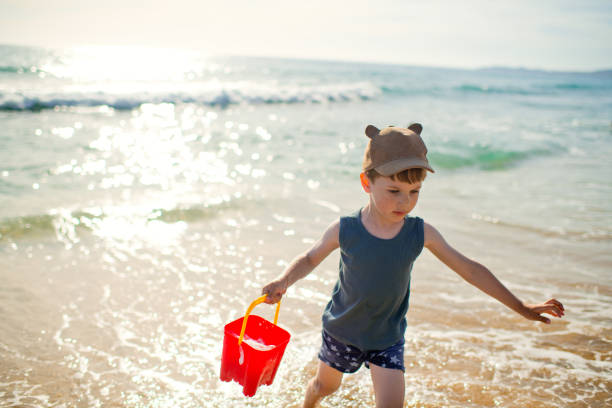 Little boy enjoying vacations near the sea