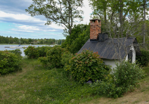 istock Small stone building in front of a lake 1486860292