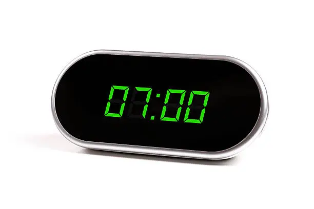 Photo of digital alarm clock with green digits