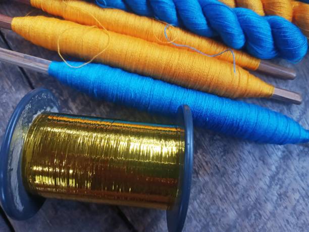 istock Bundles of Threads for Weaving on Wooden Surface 1486861974