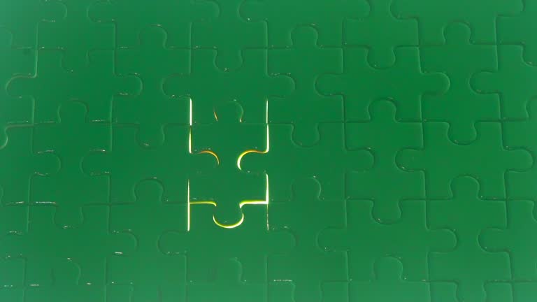 Light puzzle putting the jigsaw puzzle filling by hand (chroma key)