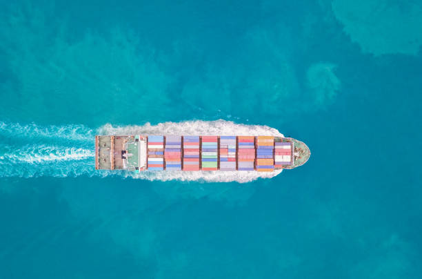 istock Top view Container ship loading and unloading in sea port, Aerial view of business logistic import and export freight transportation by container ship in harbor, Container loading Cargo freight ship, Dubai 1486864248