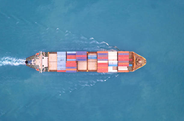 istock Top view Logistics and transportation of Container Cargo ship and Cargo plane with working crane bridge in shipyard at sunrise, logistic import export and transport industry background 1486864260
