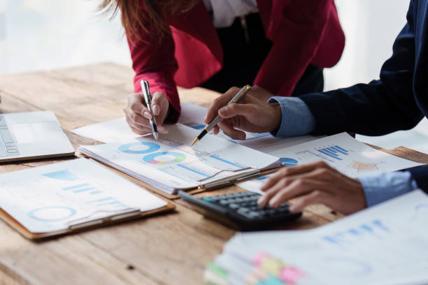 istock Group of Businessman or Accountant checking finance data document for investigation of corruption account. Anti Bribery concept 1486866672