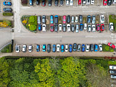 Drone top down view of many parked private cars.