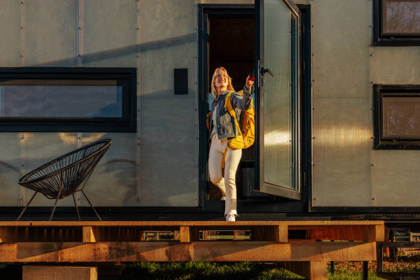 istock Happy woman at weekend getaway cabin. 1486872788