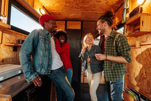 istock Cheerful friends socializing in weekend cabin. 1486873287