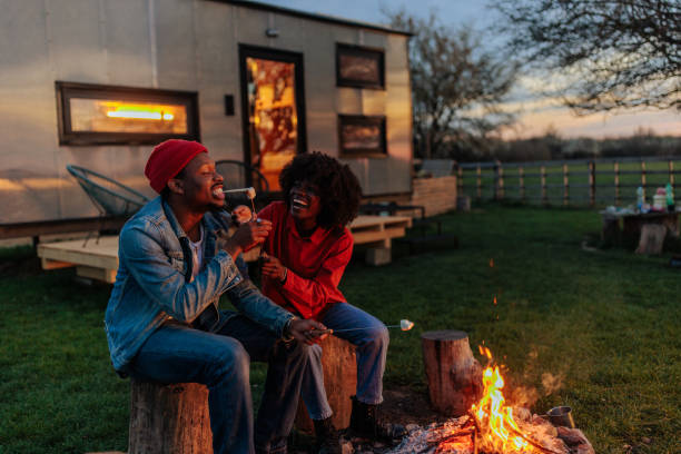 istock Couple enjoying at campfire on weekend. 1486873491
