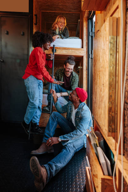 Friends relaxing at weekend cabin.