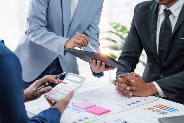 istock Group of Diverse Creative discussion about analyzing data financial report and new start up project, discussion the charts and graphs, Business finances and accounting concept 1486873790