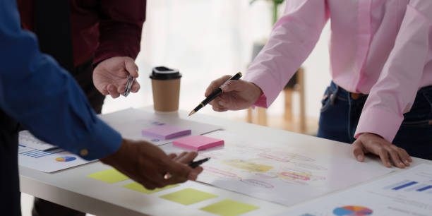 istock Group of Diverse Creative discussion about analyzing data financial report and new start up project, discussion the charts and graphs, Business finances and accounting concept 1486874609