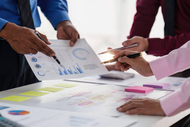 istock Group of Diverse Creative discussion about analyzing data financial report and new start up project, discussion the charts and graphs, Business finances and accounting concept 1486875039