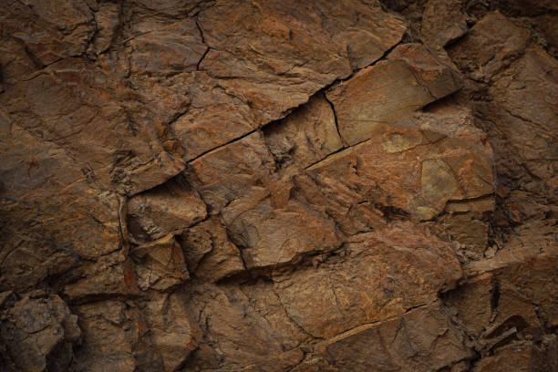 istock Red brown rock texture. Mountain surface. Close-up. Stone background. 3d. Nature. Rough, cracked, crushed. 1486875087