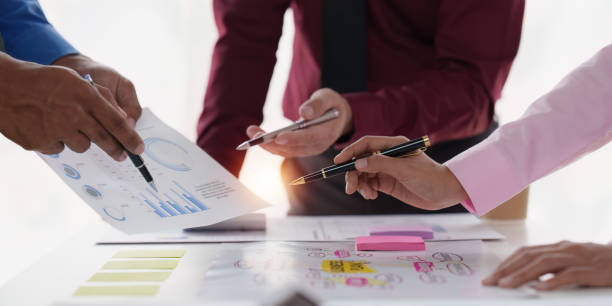 istock Group of Diverse Creative discussion about analyzing data financial report and new start up project, discussion the charts and graphs, Business finances and accounting concept 1486875136