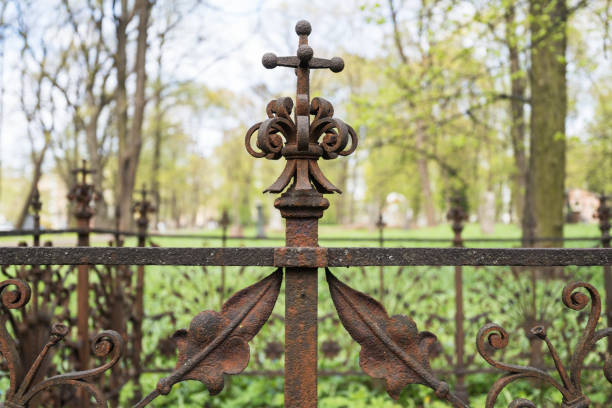 Close-up of an old cemetery fence