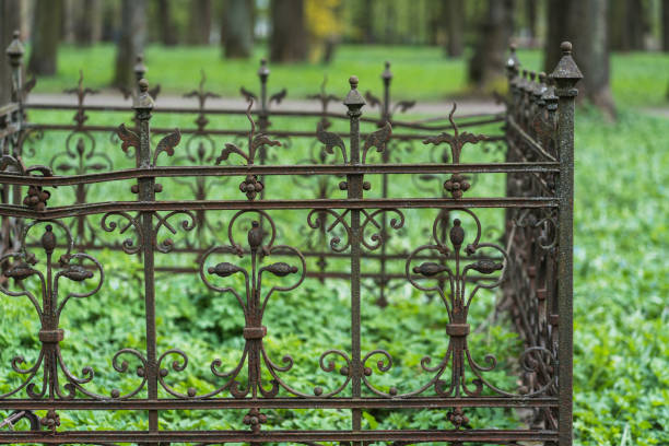 Close-up of an old cemetery fence