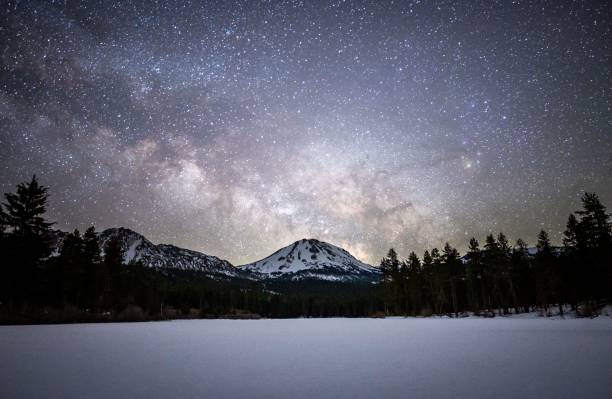 istock Majestic mountain range illuminated by the starry night sky 1486879366