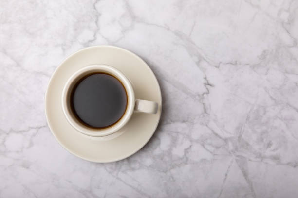 istock Fragrant coffee in a cup on a marble background.Espresso. Morning drink. Cheerful morning concept. Place for text. Place to copy. 1486880194