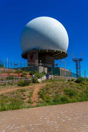 Pedestrian access to Pico do Areeiro and white dome of radar station N°4 on the Portuguese island of Madeira.