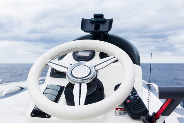 istock Motor boat control panel. Steering wheel, gear levers and control buttons. 1486882748