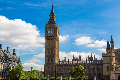 Close up of Big Ben clock tower against cloudy sky in London in a beautiful summer day, England, United Kingdom