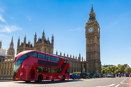 Big Ben, Westminster Bridge and red double decker bus in London, England, United Kingdom