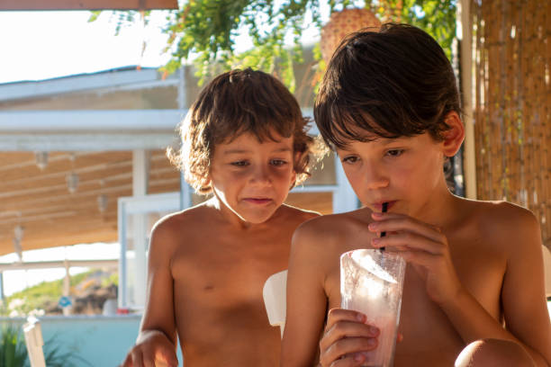 istock Brothers for milkshake cocktail on the beach 1486887059