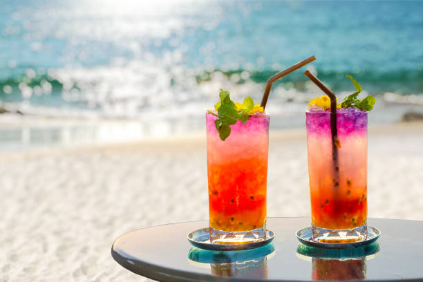 two colorful cocktails on the beach in summer two colorful cocktails on the beach in summer goa beach party stock pictures, royalty-free photos & images