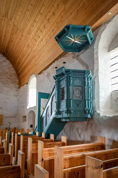 July, 2022. Sastamala, Finland. The pulpit of medieval stone church built in the 16th century and reconstructed after fire in 1997-2003.