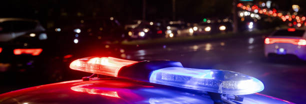 police car lights at night in city stock photo