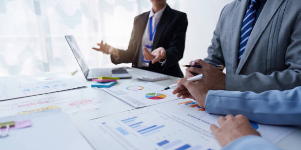 istock Group of Business people using AI to help and analysis and research finance data. Artificial Intelligence, Futuristic technology transformation concept 1486896392
