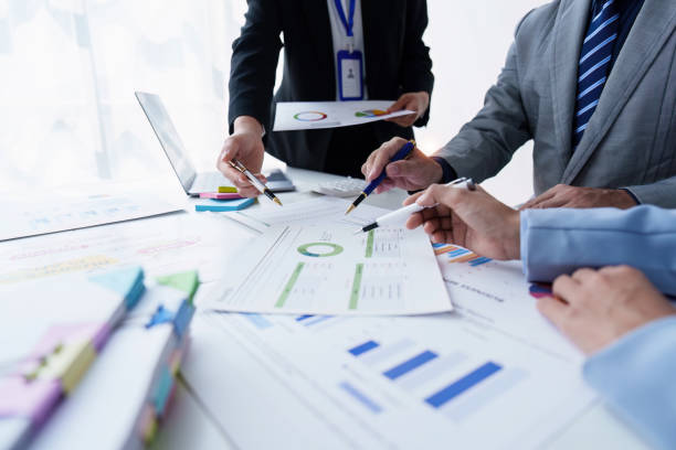istock Group of Business people using AI to help and analysis and research finance data. Artificial Intelligence, Futuristic technology transformation concept 1486896920