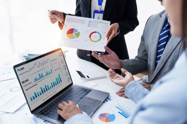 istock Group of Business people using AI to help and analysis and research finance data. Artificial Intelligence, Futuristic technology transformation concept 1486896999