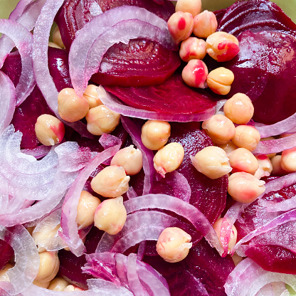Above view of fress salad of beet with cooked chickpeas
