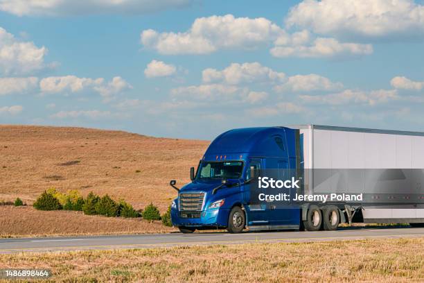 Closeup Shot Of A Royal Blue Semi Truck Driving On I70 West Across Kansas On A Sunny Day Stock Photo - Download Image Now