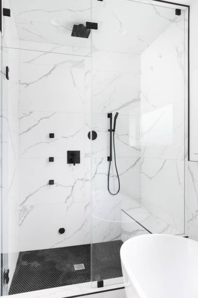 istock A walk-in shower with marble and circular tiles. 1486899455