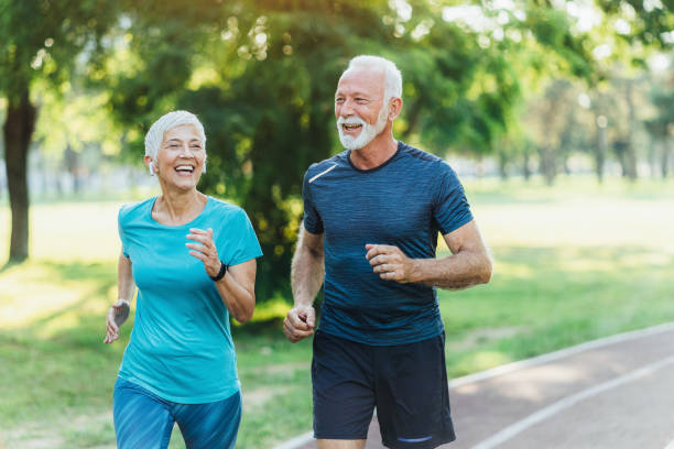 istock Senior friends jogging together 1486901623